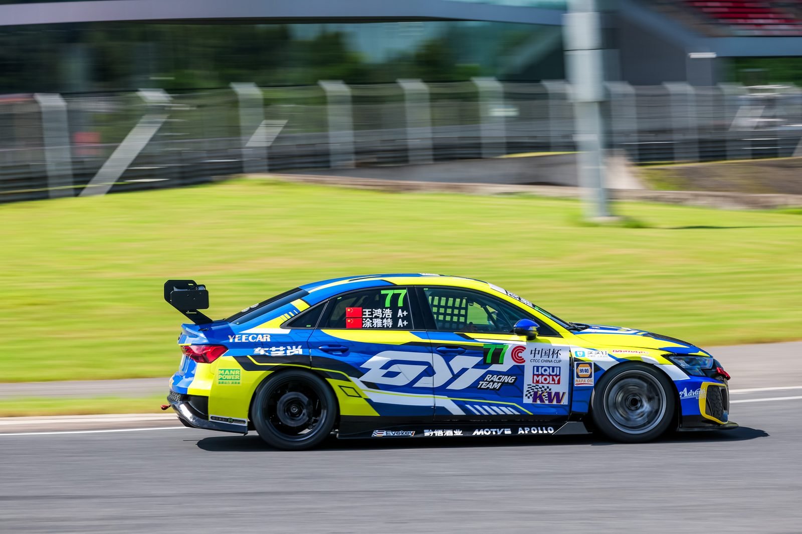 Race car at speed on circuit
