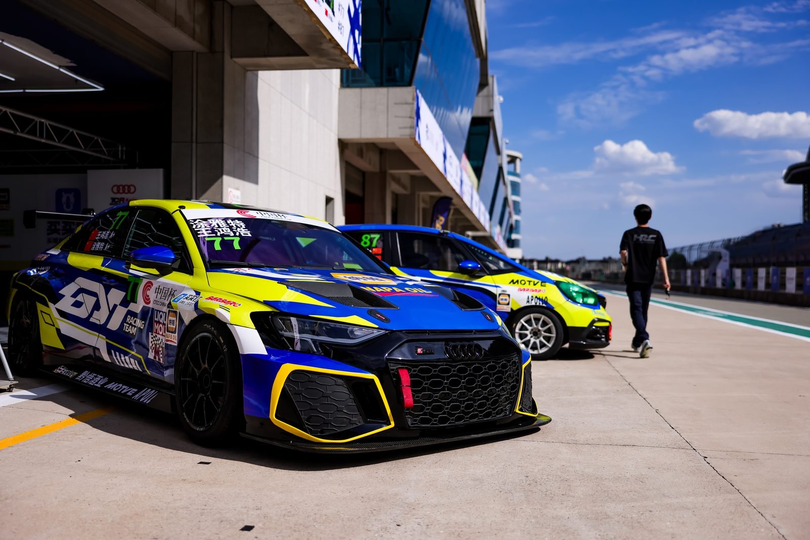 Race cars in pit lane